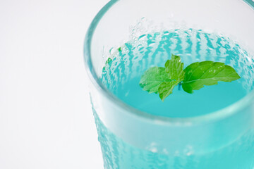 Refreshing blue iced drink with mint leaves