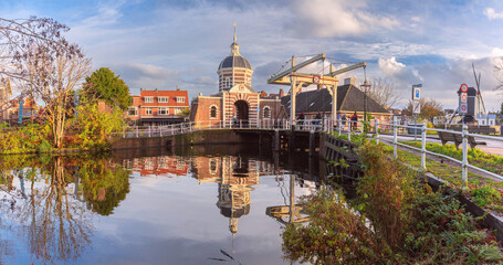 Historic Morspoort city gate and canal reflection in Leiden Netherlands