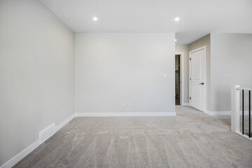 White room with a white wall and a white door