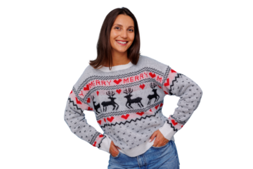 Smiling woman posing in festive christmas sweater with reindeer and hearts, celebrating winter holidays