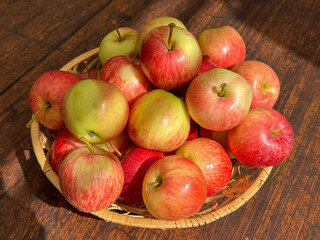 Basket of Apples on Wooden Table