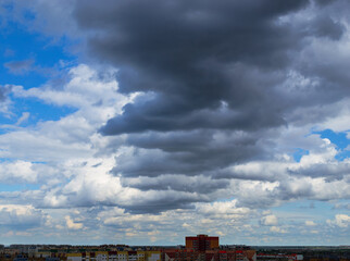 Cloudy sky over city apartment buildings