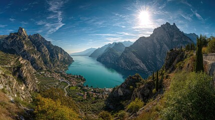 Panoramic view of a lake nestled between mountains under a clear blue sky.