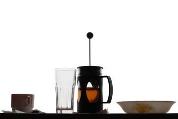 A coffee press with tea.
