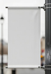A blank vertical street banner mockup on a lamppost for a city advertisement presentation a modern building and blue sky in the background