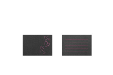 A black card with pink handwritten hearts and ruled lines, photographed from overhead.
