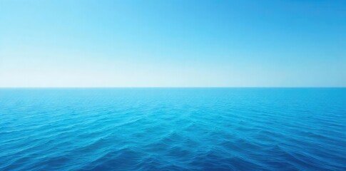 Obraz premium Vast, tranquil ocean stretching to the hazy horizon line under a clear blue sky Perfect for travel, serenity, and nature themes A calming seascape image , peaceful, coast