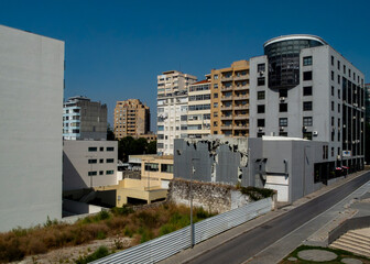 A view of buildings in an urban setting on a sunny day.