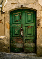An old green door with the number 38 above it.