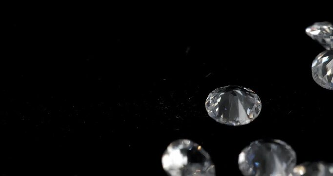 Jewelry zirconia stones on a dark background. Artificial gemstones on a rotating table.