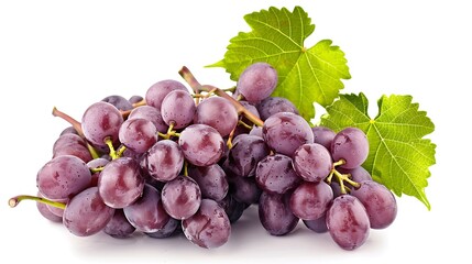 A bunch of fresh red grapes with green leaves isolated on a plain white background in close up shot