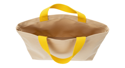 Beige canvas tote bag with yellow handles isolated on white, reusable shopping bag for groceries and everyday use