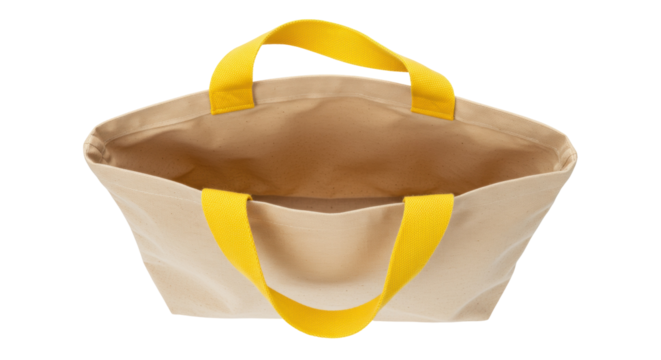 Beige canvas tote bag with yellow handles isolated on white, reusable shopping bag for groceries and everyday use