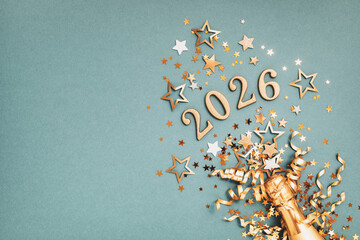 2026 glittering numbers for New Year and Christmas celebration with golden champagne bottle top view.