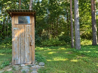 Sustainable Wooden Eco Outhouse Concept — Rustic Dry Toilet in Forest Clearing