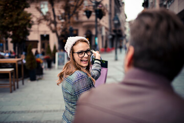 Happy woman shopping in city