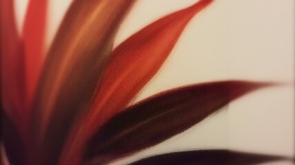 Abstract red leaves on a blurred background, symbolizing growth and nature.