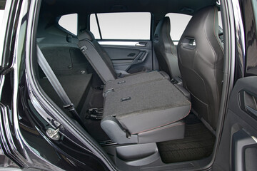 Folded part of the backrest of the rear seats in a passenger car