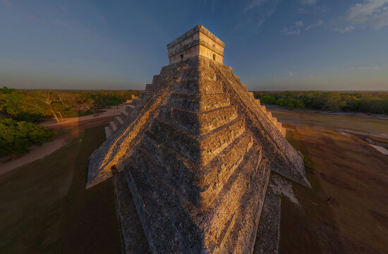 Aerial view of the majestic pyramid of Kukulkan rises with ancient stone against the horizon, bathed in the warm glow of the setting sun, Chich&Atilde;&copy;n Itz&Atilde;&iexcl;, Yucat&Atilde;&iexcl;n, Mexico.