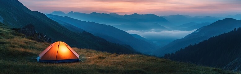 Obraz premium Illuminated tent nestled in mountain valley at dusk.