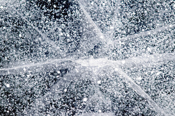 An abstract texture of a frozen river with cracks and air bubbles, emphasizing its fragility and uniqueness