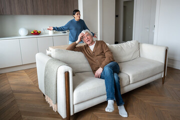 Heated argument in mature family. Frustrated agitated wife nagging criticizing indifferent lazy...