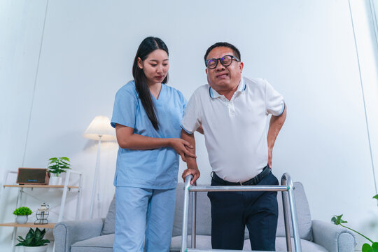 Caregiver Assisting Elderly Man with Walking Frame in Modern Living Room, Highlighting Aged Care and Compassionate Support