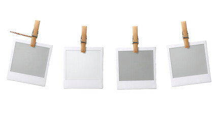 Four instant photo frames hanging on a clothesline with wooden clothespins, isolated on transparent background