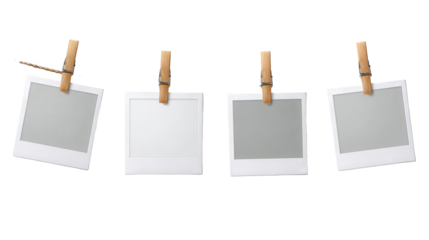 Four instant photo frames hanging on a clothesline with wooden clothespins, isolated on transparent background