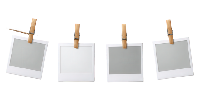 Four instant photo frames hanging on a clothesline with wooden clothespins, isolated on transparent background