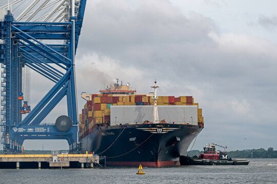 A tugboat executes a berthing maneuver to secure the container ship MSC Texas to its mooring at Hugh K. Leatherman Terminal in Charleston Harbor, SC, USA on September 28, 2025.