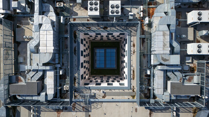 Aerial view of a geometric dance of industrial architecture and checkerboard patterns, a rooftop oasis in the heart of the city, Bydgoszcz, WojewÃ³dztwo kujawsko-pomorskie, Poland.