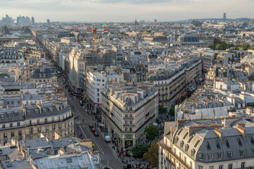 Paris, France - 09 27 2025: Panoramic view of West Paris neighborhood, Rivoli, Paris Court and La Defense district behind at sunset