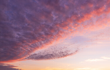 Dramatic purple and orange clouds fill the sky during either sunrise or sunset.