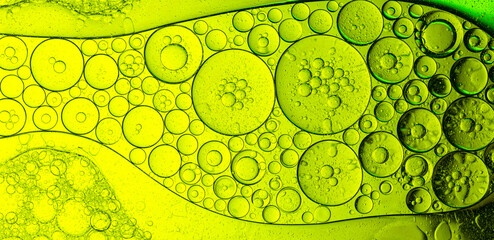 Close-up macro green drink bubbles,Water wave, close up of vibrant green liquid with bubbles,...
