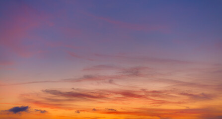 Dramatic purple and orange clouds fill the sky during either sunrise or sunset.