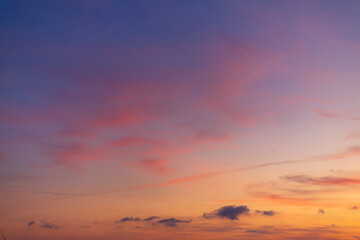 Dramatic purple and orange clouds fill the sky during either sunrise or sunset.