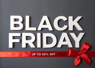 Black friday sale promotion with white letters, red ribbon and 50 off discount on a gray background