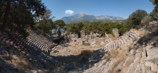 Antique amphitheatre in ancient town Phaselis and Tantali Mountain in the background. Antalya region, Turkey. High quality photo