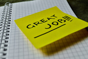 Sticky note with motivational message on notebook page