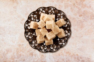Ramadan concept, sugar in muslim bronze plate