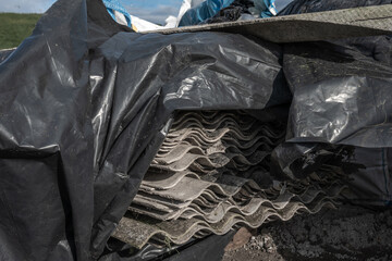Old and very dangerous asbestos roof. Asbestos dust in the environment. Health problems.