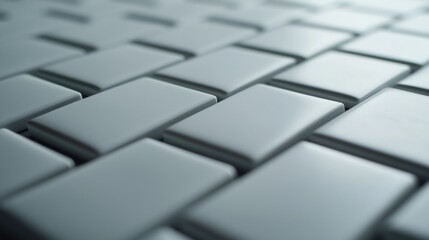 Textured gray interlocking tiles with a subtle sheen, creating a modern and sleek abstract background pattern