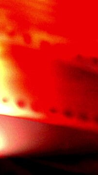 Vertical Light Film Strip Transition. Luminous binary code running down the sprocket holes. Ideal for a data stream effect.