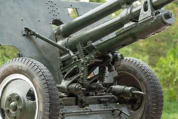 Close-up of the control mechanism of a Soviet anti-tank gun, showing construction details and aiming components.