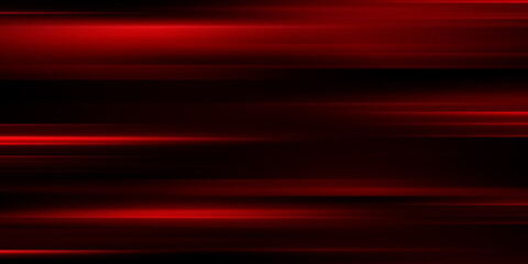 The effect of red light in fast motion on a black background. blurred abstract background with long exposure. neon light

