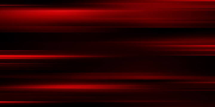 The effect of red light in fast motion on a black background. blurred abstract background with long exposure. neon light
