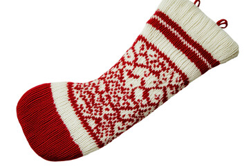 Red and white knitted christmas stocking with snowflake pattern isolated on transparent background. Traditional red and white christmas stocking with a fair isle pattern isolated on white background.