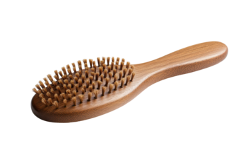 Wooden hair brush with natural bristles isolated on transparent background. Wooden paddle hair brush with a natural finish isolated on white background.