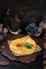 Spinach Khachapuri – Georgian Green Pie. Traditional Georgian Bread. Traditional Georgian cuisine styled with authentic atmosphere.